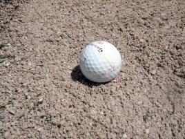 Coarse, gravelly sand greets you in the bunkers at Sundre Golf Club.